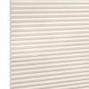 Cream honeycomb (cellular) window shade with horizontal pleats and visible hexagonal cells, fully lowered and closed, softly diffusing light; photographed as a studio product shot with neutral background.
