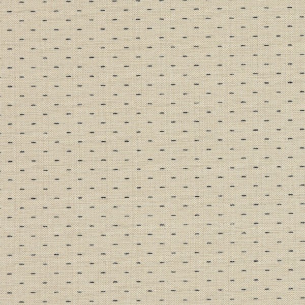 Beige woven fabric patterned with evenly spaced short navy-blue stitch dashes; close-up view showing textured weave and a subtle vertical seam, likely upholstery or curtain material in neutral indoor lighting.