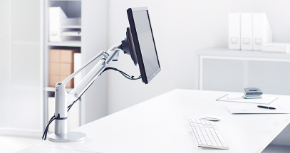 Elevates monitors off the desk surface to maximize space.