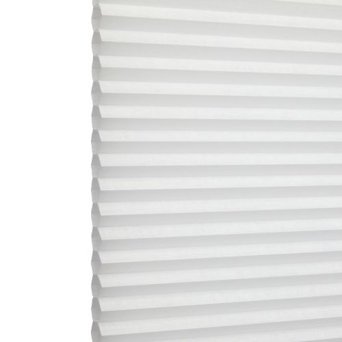 White honeycomb (cellular) blind with horizontal pleats, closed and softly diffusing daylight; minimal, bright interior with no visible furniture or view.