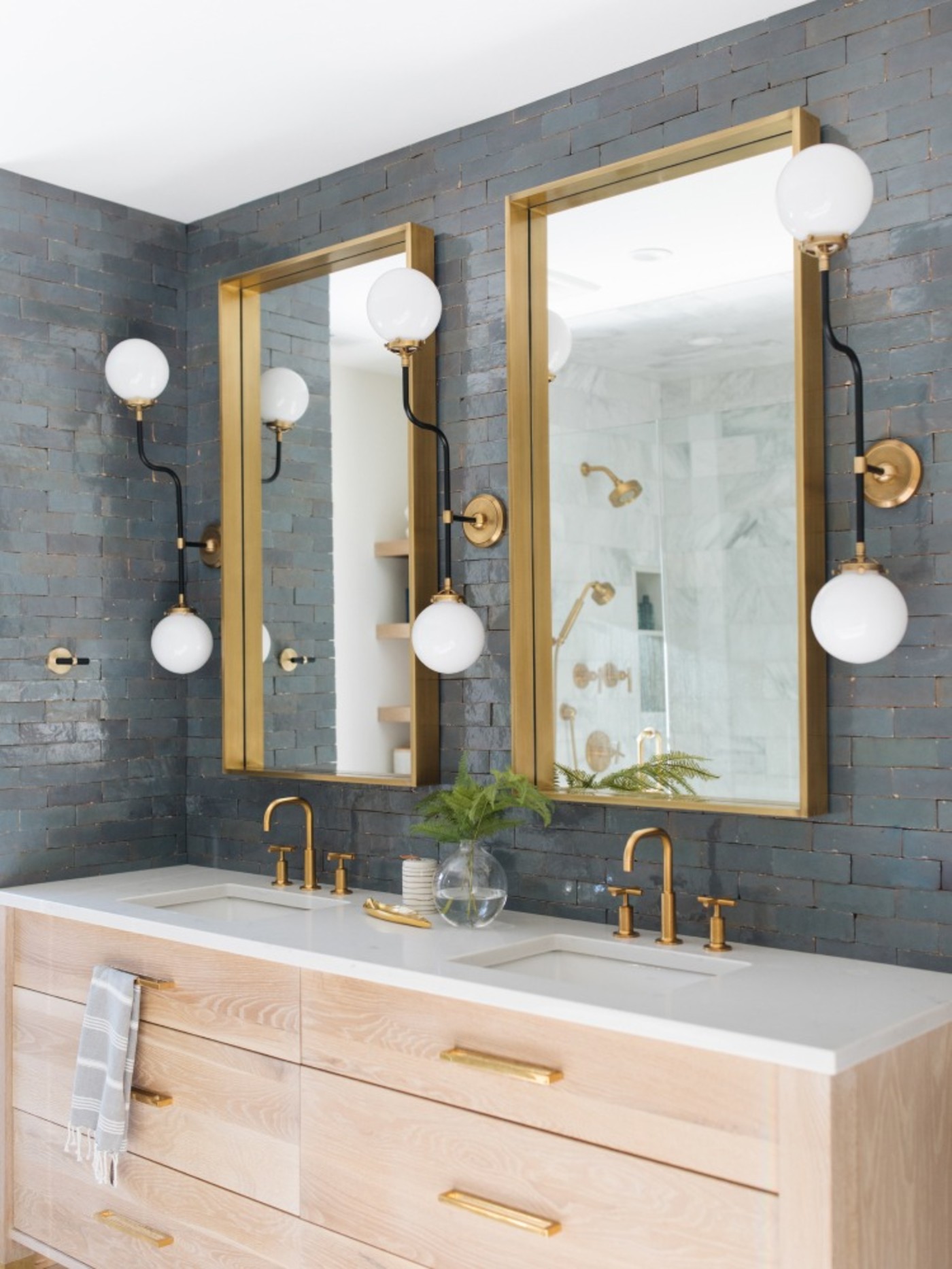 a bathroom with 2 sinks and 2 mirrors.