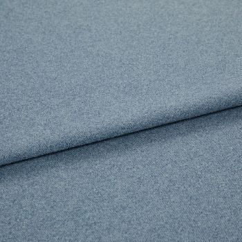 Light blue woven fabric (denim-like) folded once, forming a diagonal layered edge; close-up view showing fine texture and even studio lighting on a plain surface.