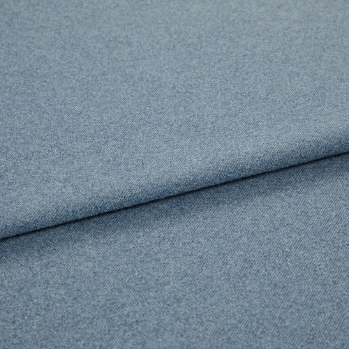 Light blue woven fabric (denim-like) folded once, forming a diagonal layered edge; close-up view showing fine texture and even studio lighting on a plain surface.