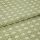 Green patterned woven fabric with raised geometric dots and lattice, folded over itself and showing textured pile; close-up studio view with soft, even lighting emphasizing the fibers.
