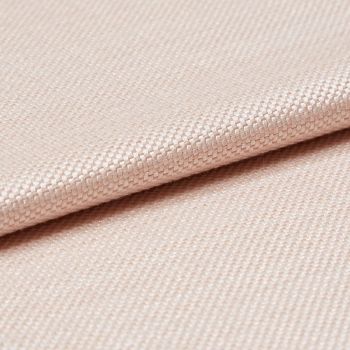 Light peach woven fabric with tight basket weave, folded in a shallow overlap; soft sheen catches diffused studio light, close-up view emphasizing texture and gentle drape.