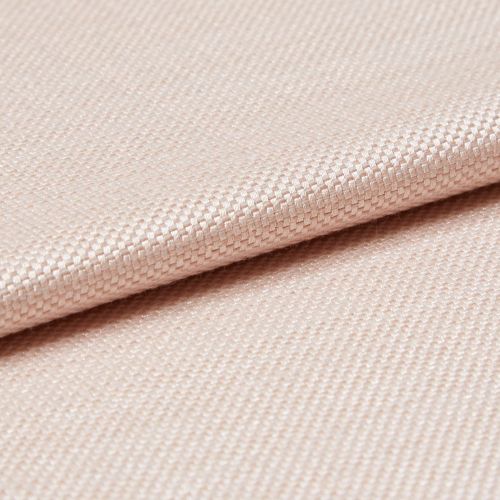 Light peach woven fabric with tight basket weave, folded in a shallow overlap; soft sheen catches diffused studio light, close-up view emphasizing texture and gentle drape.