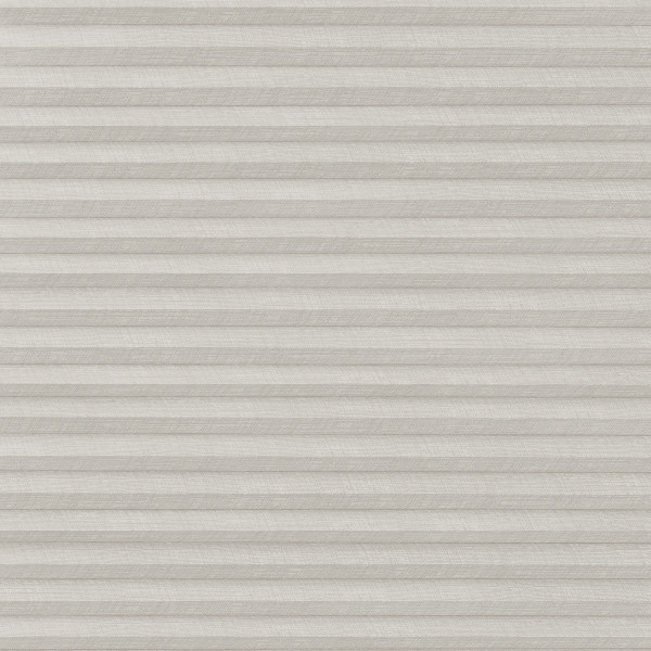 A closed light-gray pleated cellular blind with subtle linen texture, filtering and diffusing light evenly, covering a window within a neutral, softly lit interior.