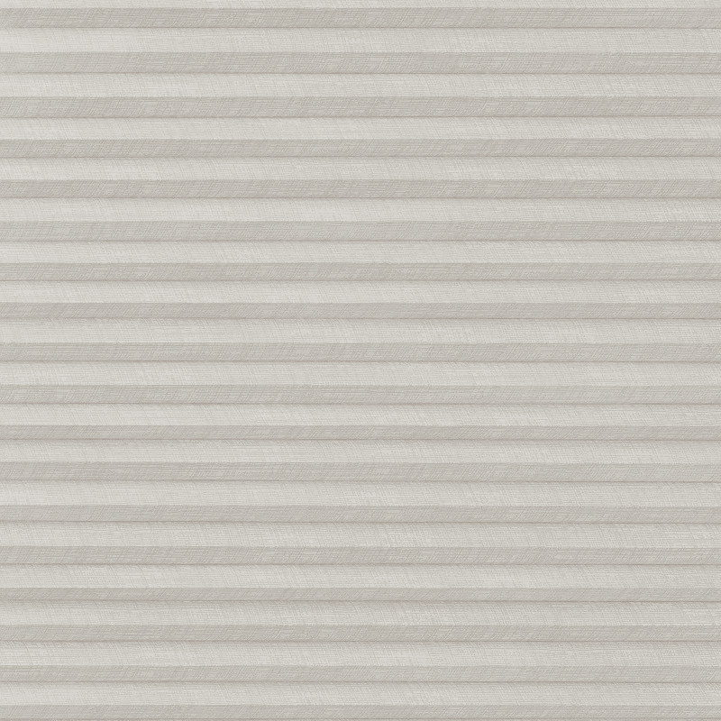 A closed light-gray pleated cellular blind with subtle linen texture, filtering and diffusing light evenly, covering a window within a neutral, softly lit interior.