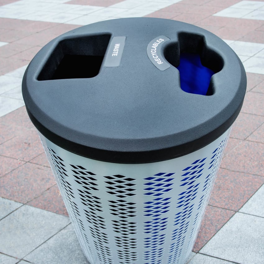 closeup of double waste and recyclables lid on powder coated steel body on a city sidewalk