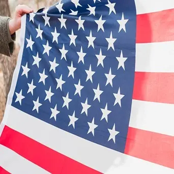 photo of an American flag beign held
