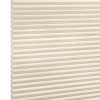 Beige honeycomb (cellular) blind, fully lowered with horizontal pleats and visible cells; closed and softly diffusing daylight; set against a neutral white-lit background with no visible room or view.