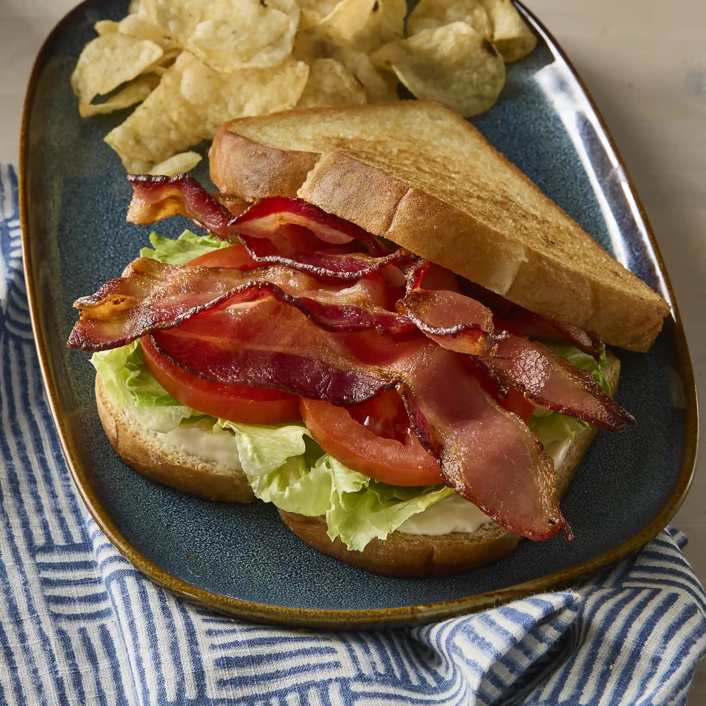 Wright® Brand Naturally Hickory Smoked Flat-Pack® Bacon, 18-22 Slices per Pound https://images.salsify.com/image/upload/s--v3AGdB6q--/q_25/824657a85124857f36f3d14e2fe7ffa0410523e8.webp