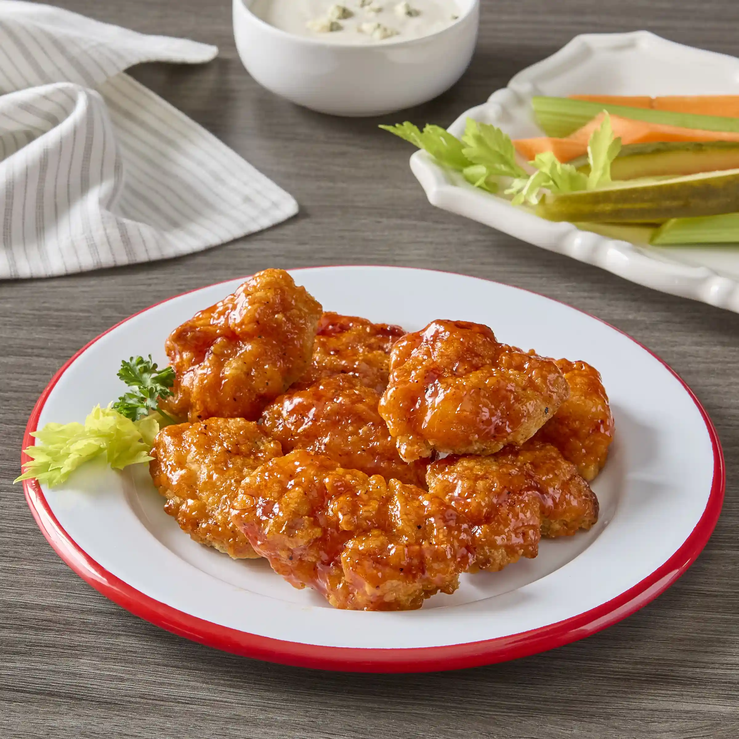 Tyson® Uncooked Chicken Breast Chunk Fritters with Buffalo Style Glaze Packets https://images.salsify.com/image/upload/s--sOO9uHIG--/q_25/xeupyd4xtjlr64rubj7u.webp