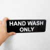 "HAND WASH ONLY" contemporary English symbol sign