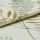Cream linen fabric with gold and green embroidered fern and leaf motifs, folded to reveal raised satin and outline stitches catching light; close-up studio view with soft, diffuse lighting.