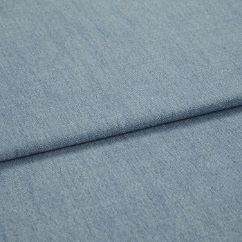 Light-blue woven denim-like fabric, folded diagonally with a shallow overlapping fold; surface shows fine weave and subtle striations, close-up view with soft, even lighting.