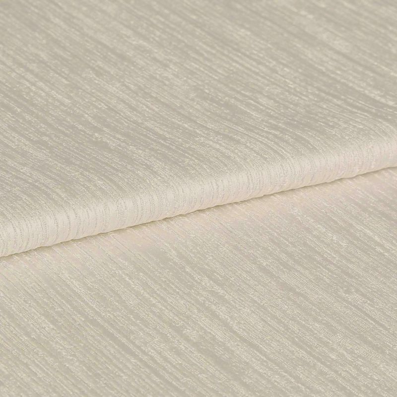 Folded cream, ribbed curtain fabric sample; tightly folded edge across the center, showing subtle horizontal textured stripes; close-up on a flat surface under soft, even studio lighting.