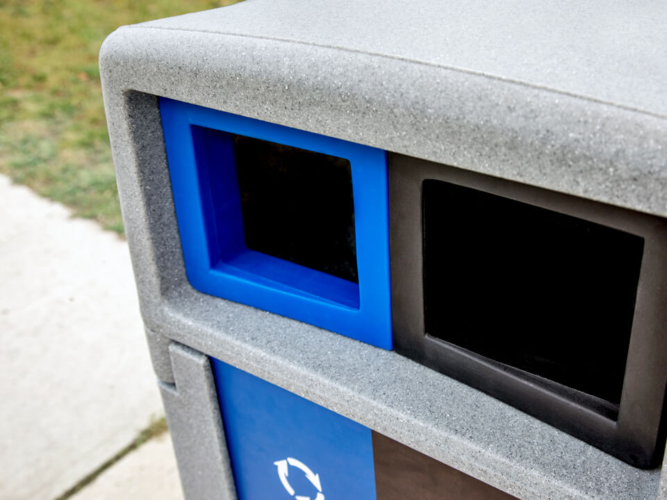 closeup view of the canopy lid on a waste and recycling container made from durable LDPE plastic sitting outside on a city sidewalk