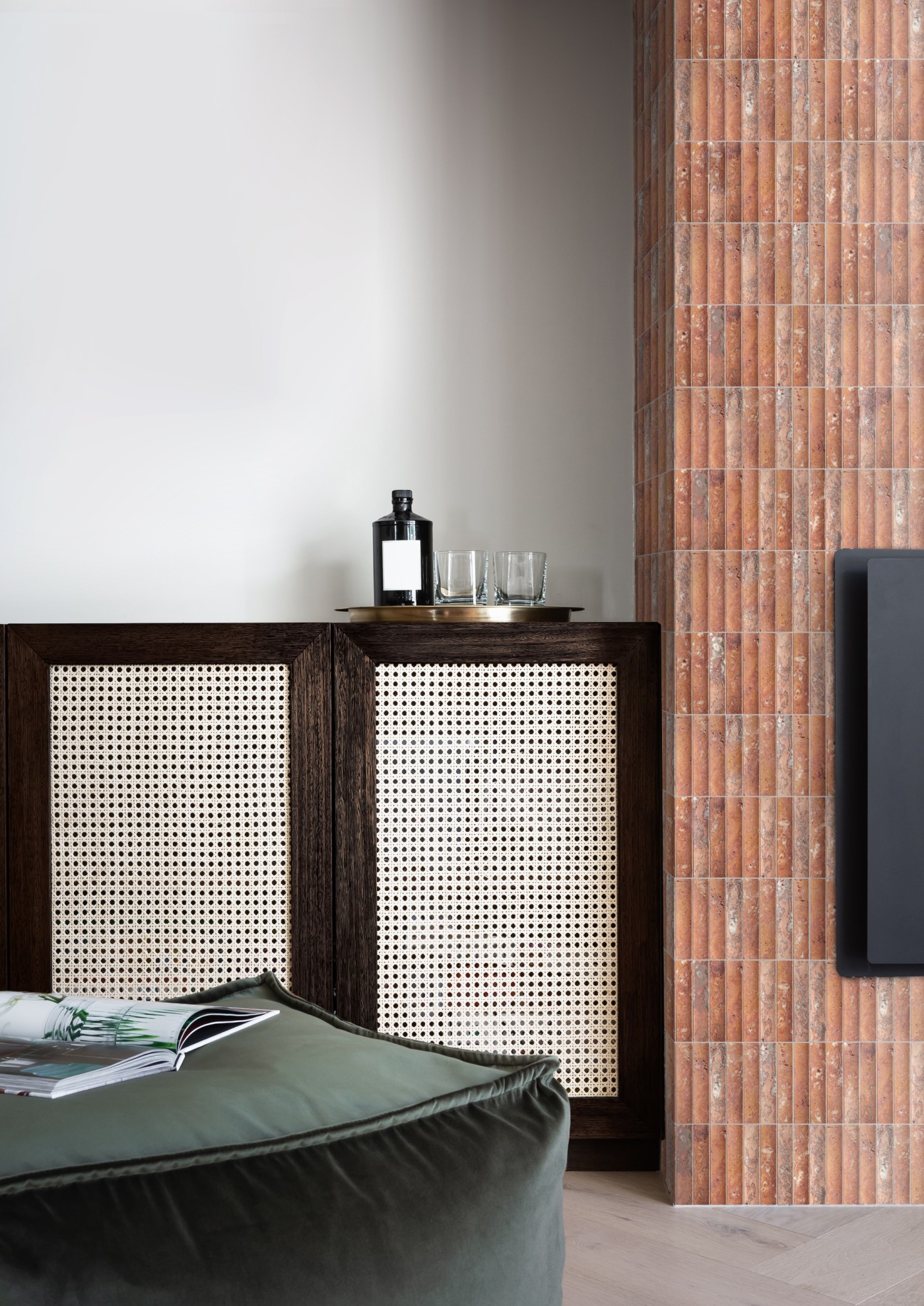 a living room with a tiled fireplace hearth.