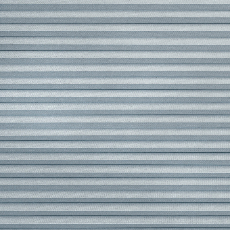 Horizontal pleated fabric blinds covering the entire window, closed in even light-blue-gray folds; filtering and diffusing daylight; interior setting with soft, uniform ambient lighting and no visible view.