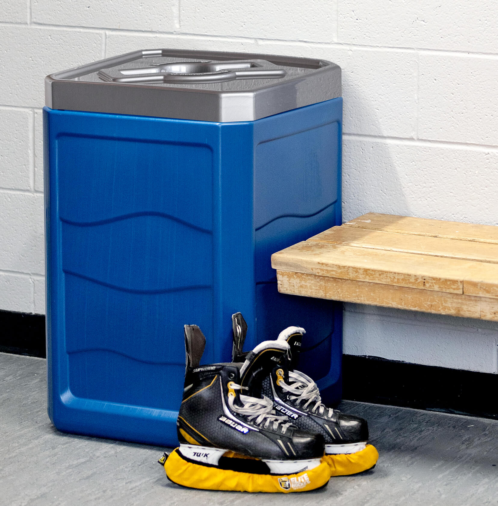 100% PCR recycling bin with pewter finish mixed opening lid in a hockey dressing room