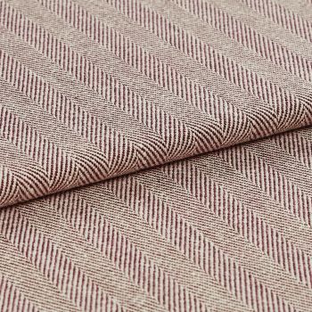Woven upholstery fabric with beige-and-burgundy diagonal herringbone stripes and ribbed texture; folded and overlapped to reveal the pattern repeat; close-up, evenly lit studio setting.