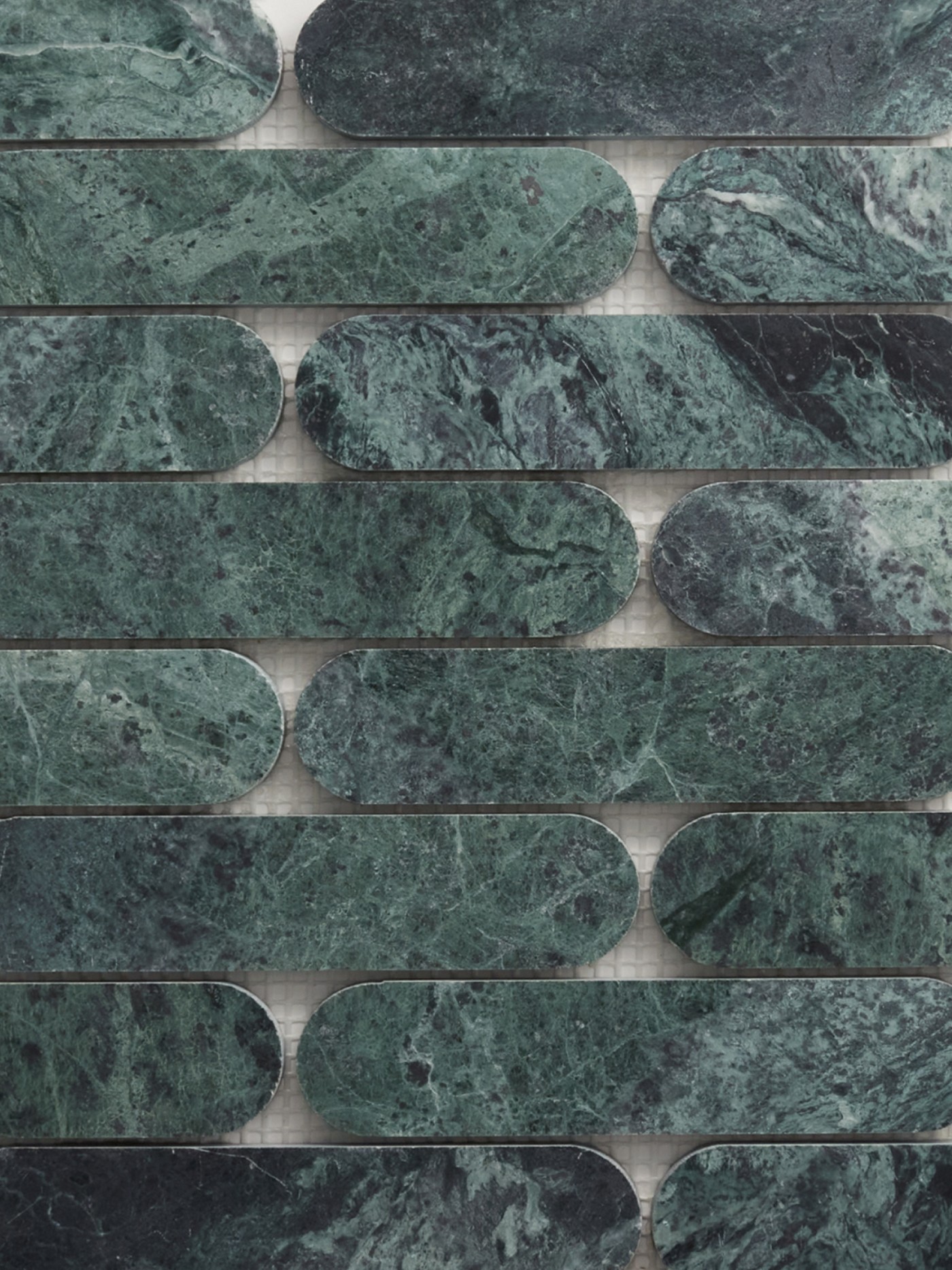 oval, green natural stone tiles arranged in a pattern.