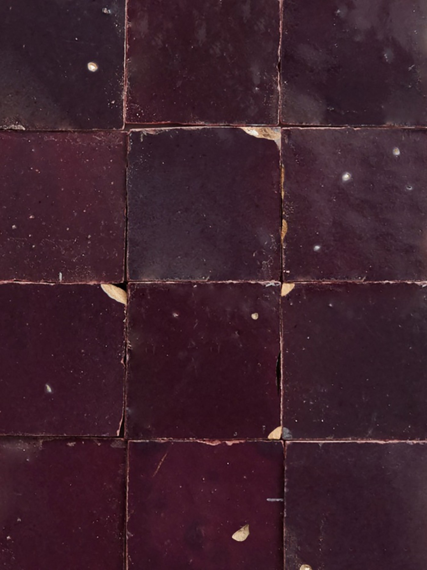 a close up of brown square tiles.