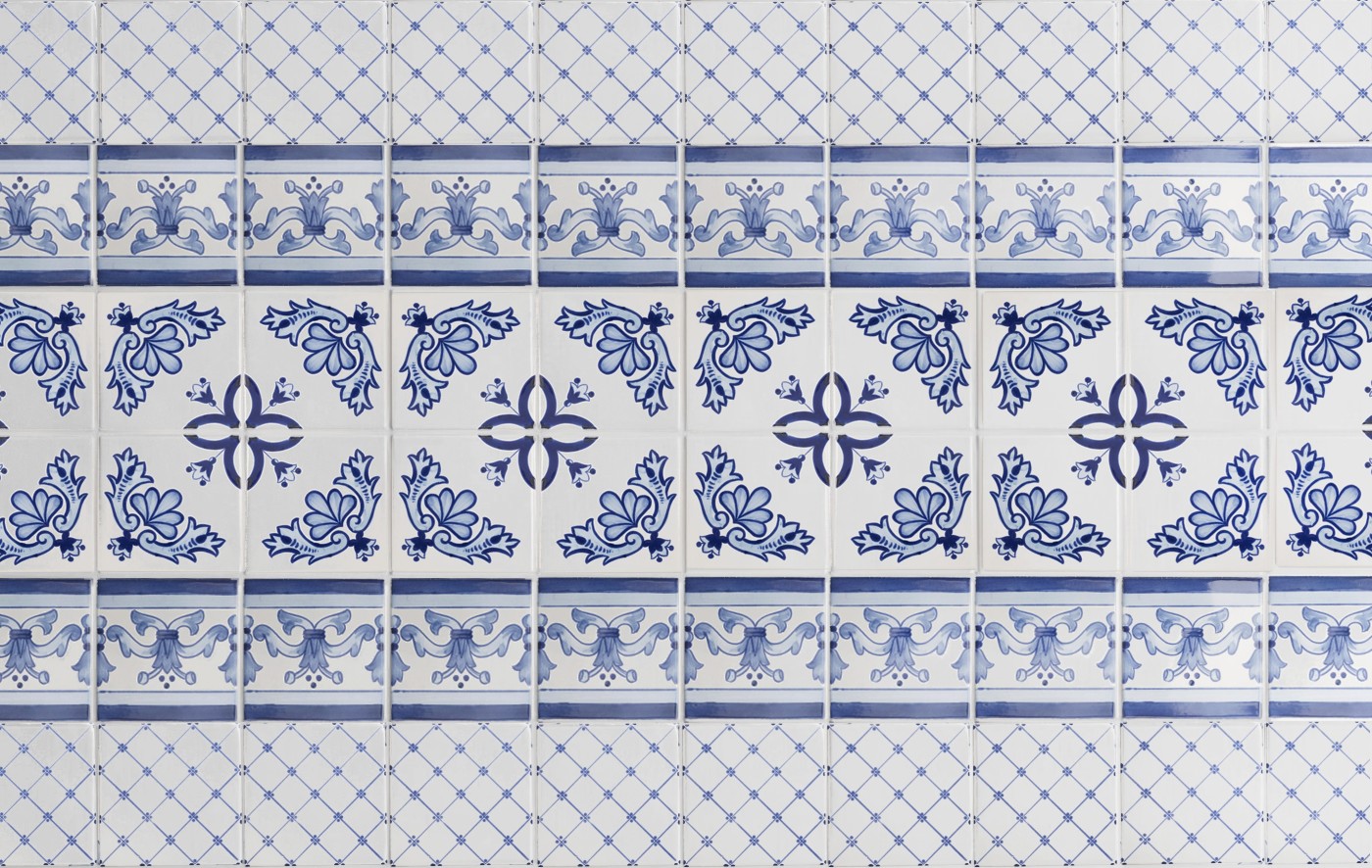 blue and white tiles with designs on them.