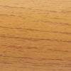 Wooden veneer panel with fine horizontal grain; smooth, warm honey finish displaying darker streaks; close-up of a tabletop or wall panel bathed in soft, warm indoor light.