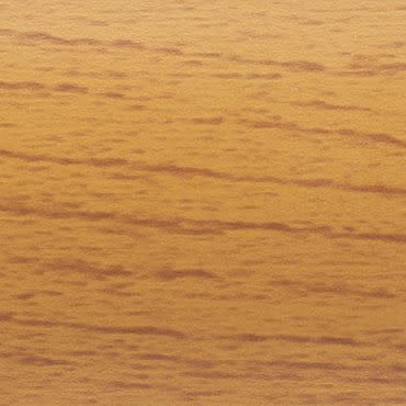 Wooden veneer panel with fine horizontal grain; smooth, warm honey finish displaying darker streaks; close-up of a tabletop or wall panel bathed in soft, warm indoor light.