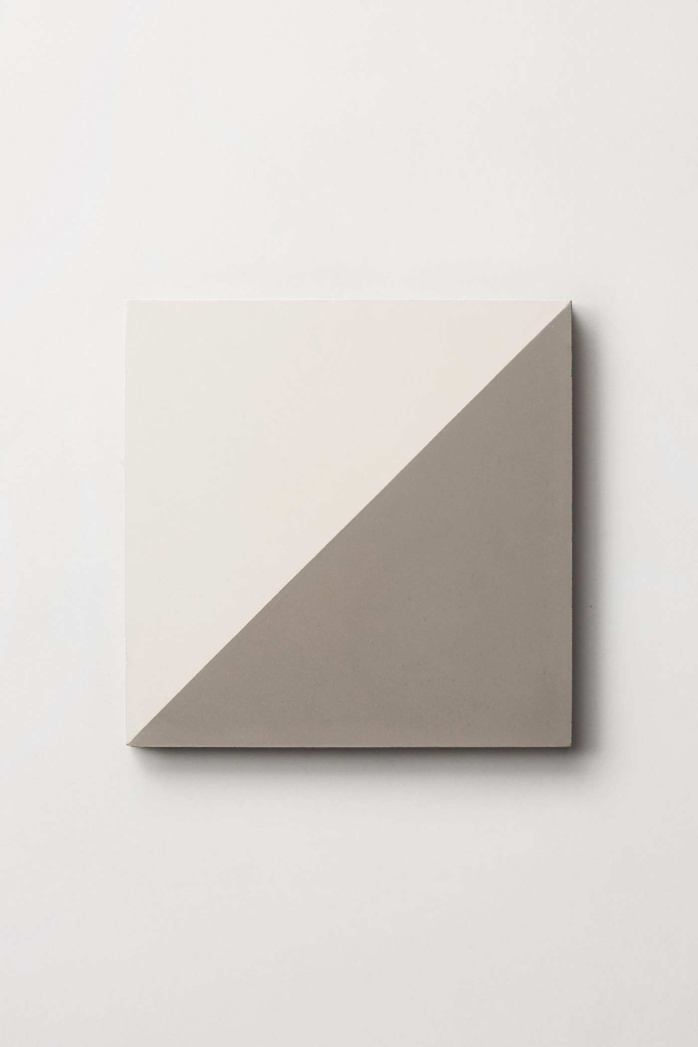 a white and grey square on a white wall.