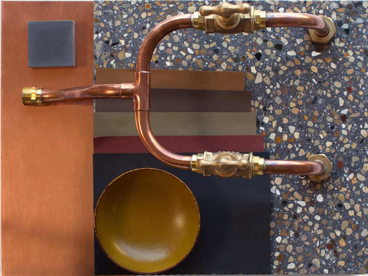 a copper sink with a bowl on top of it.