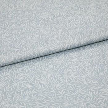 Light-blue printed fabric with a white leaf motif folded once and overlapping; close-up of a soft woven textile surface under even, neutral lighting.