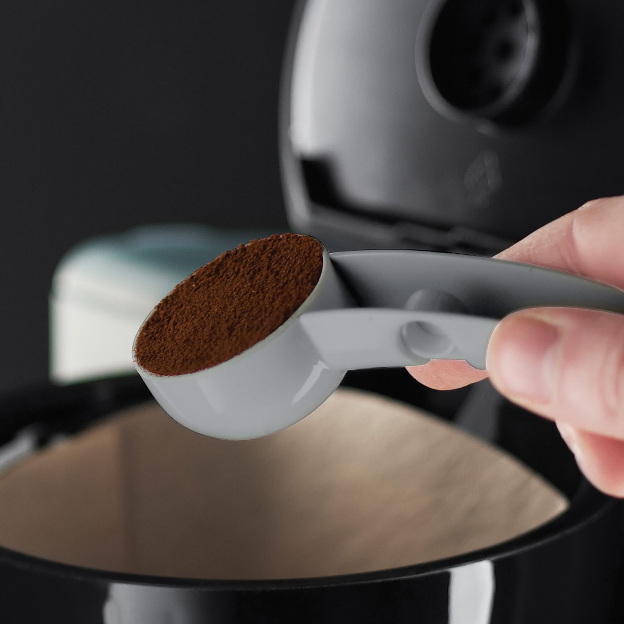 Easy 8 cup coffee maker being used to make coffee.