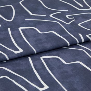 Navy-blue fabric with white abstract linear print, folded once; fabric rests flat, studio-lit close-up revealing woven texture and a visible fold/seam.