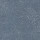 Bluish-gray textured surface  lies motionless  in a close-up view (context), covered with fine white speckles and subtle uneven grain suggesting worn fabric or painted concrete.