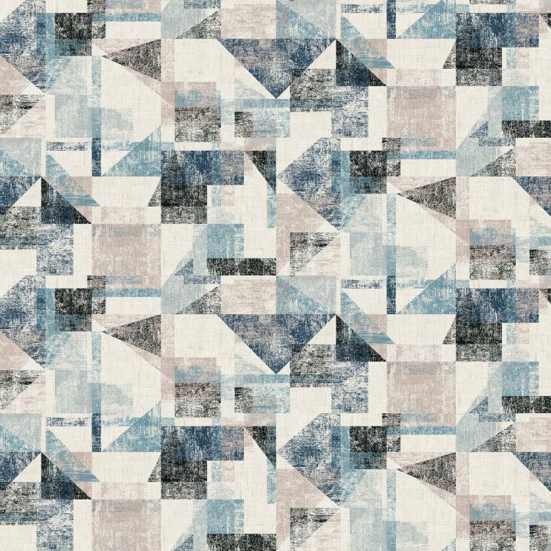 Distressed geometric wallpaper with overlapping triangles and rectangles in muted blue, beige and black; repeating across the flat surface; appears as a textured mid-century-modern wall covering under soft, neutral lighting.