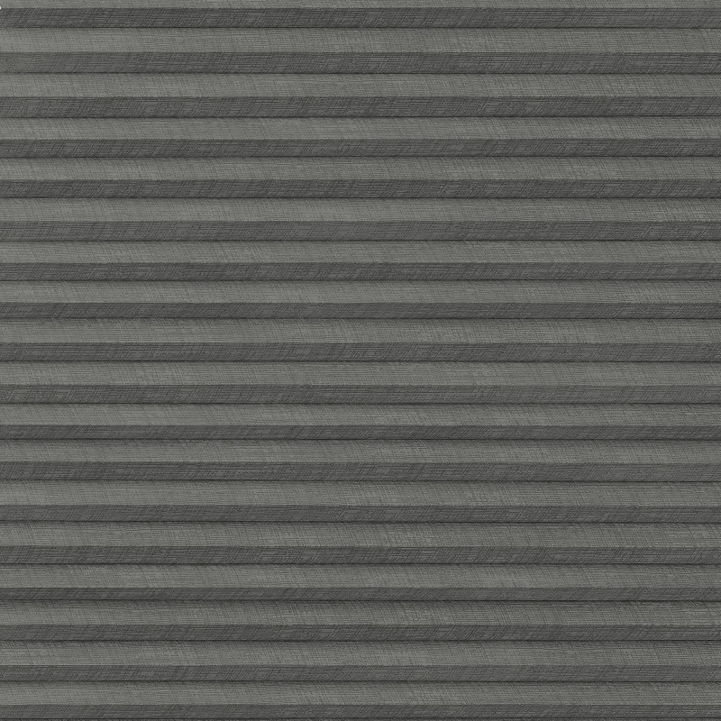 Gray pleated fabric blind with horizontal accordion folds â€” closed and blocking light â€” fills the window frame, evenly lit interior, no visible view or furnishings.