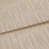 Beige textured fabric with raised, irregular wavy stripes—folded once across the middle—close-up view of a textile sample under soft, neutral studio lighting.