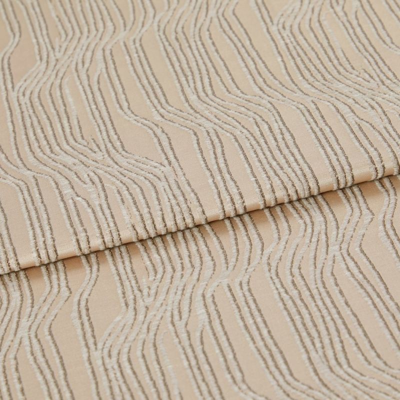 Beige textured fabric with raised, irregular wavy stripesâ€”folded once across the middleâ€”close-up view of a textile sample under soft, neutral studio lighting.