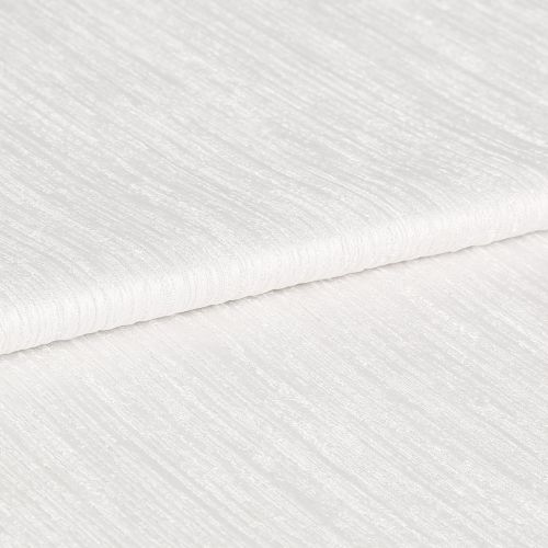 White ribbed textured fabric, folded in overlapping layers showing subtle horizontal sheen; lying stacked on itself, photographed in close-up under soft, even studio lighting with a neutral background.