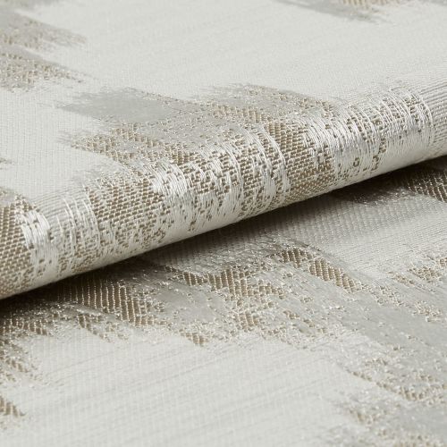 Woven curtain fabric, folded to reveal a metallic-thread abstract pattern and textured weave, reflecting light; close-up, neutral studio lighting.