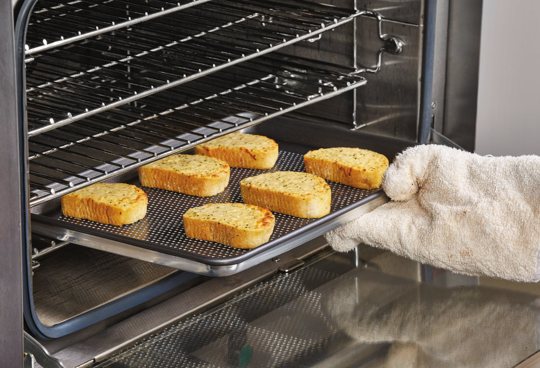 Half-size Wear-Ever® perforated aluminum sheet pan with nonstick coating