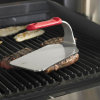 2 ½-pound flat-bottom stainless steel steak weight with red silicone handle
