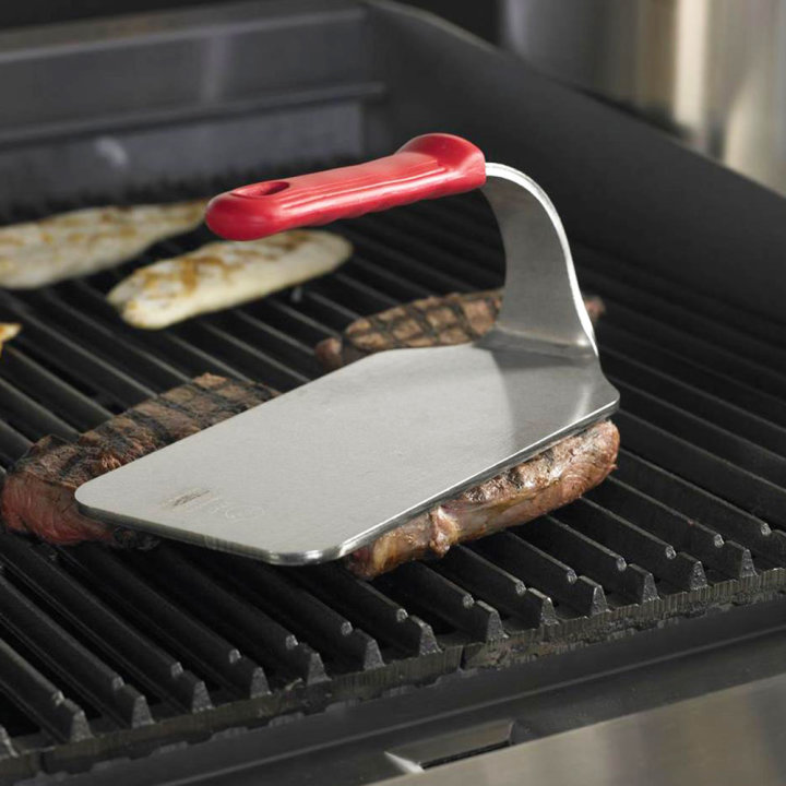 2 ½-pound flat-bottom stainless steel steak weight with red silicone handle