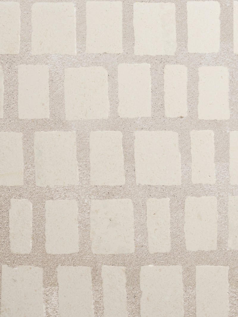 a white tile with squares on it.