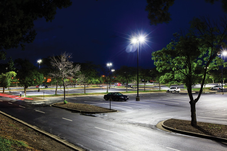 Parking lot with Evolve Outdoor Area Lights and Daintree Wireless Lighting Control WANSI node