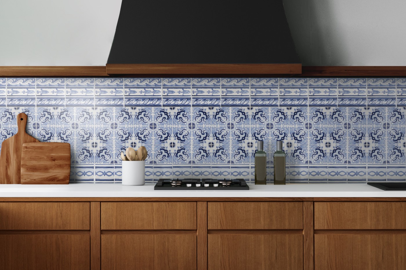 a blue and white tiled stove backsplash in a kitchen.