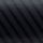 Venetian blind slats casting diagonal dark stripes across a textured black surface, filtering soft light in a dim, close-up scene with subtle grain and low contrast.